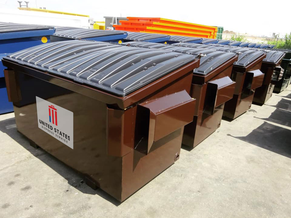 Row of brown dumpsters with the United States Disposal Service logo